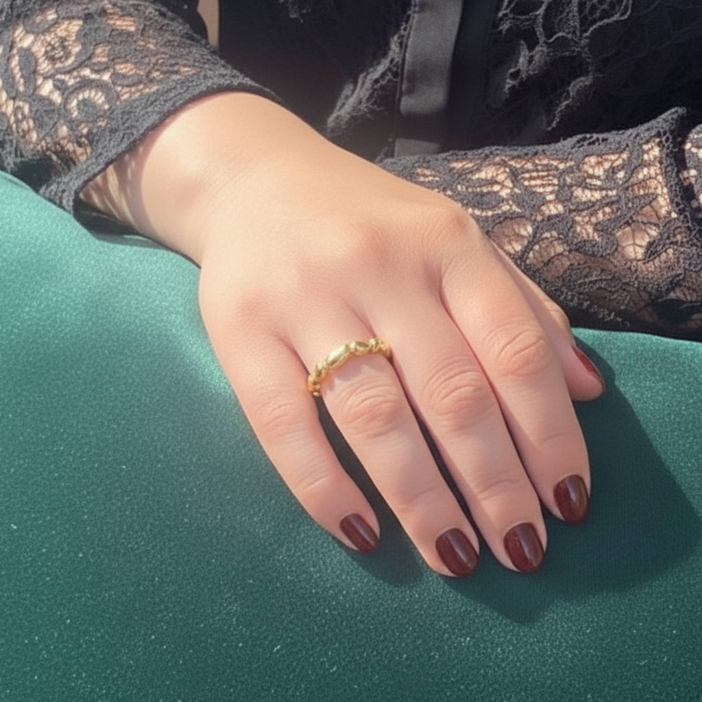 Aimless A gold vermeil ring worn on hand showing delicate organic fluid texture