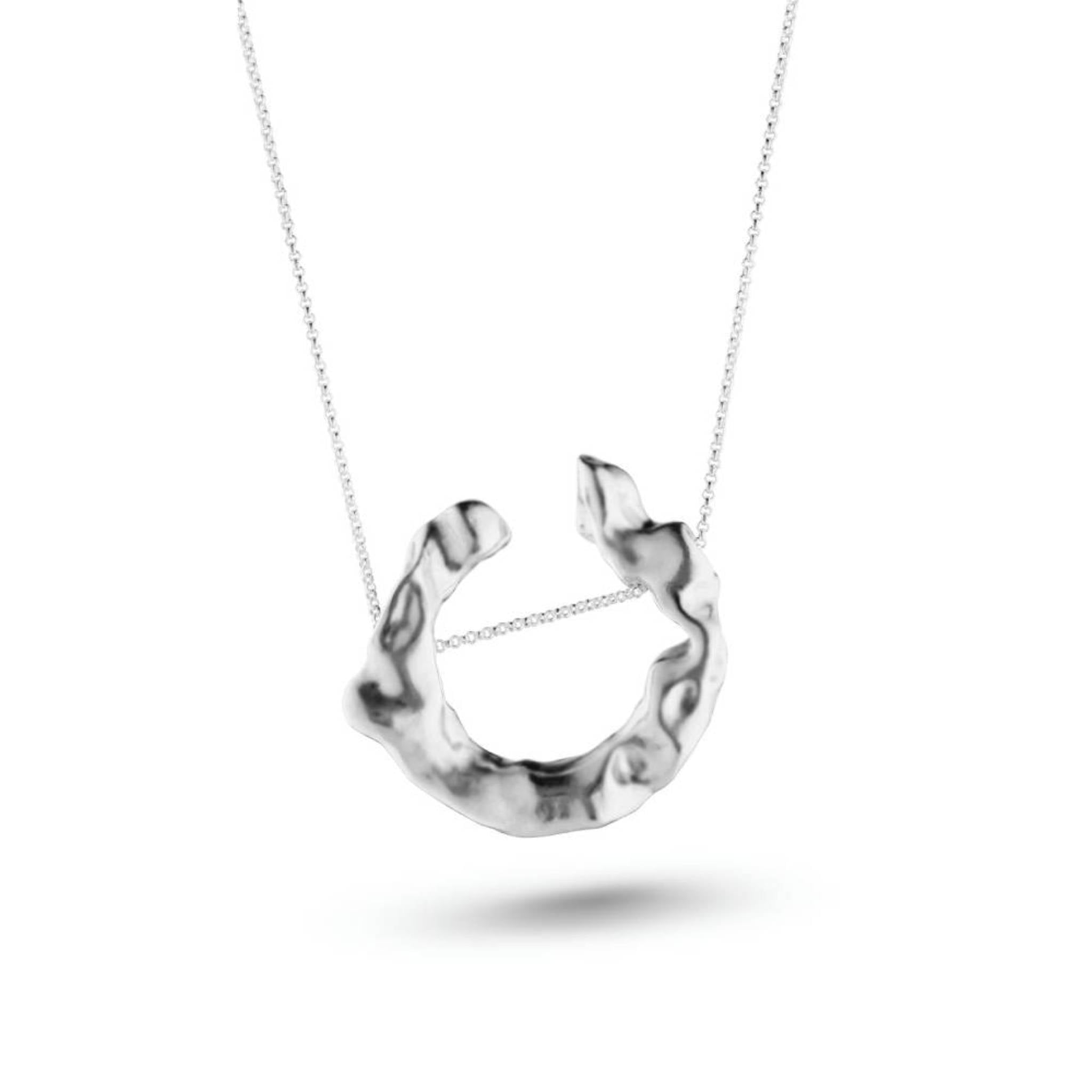 Aimless recycled sterling silver open molten circle pendant necklace close up on white background