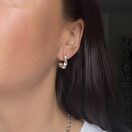 Aimless sterling silver chunky hoop earrings worn by model showing statement thickness