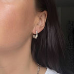 Aimless sterling silver chunky hoop earrings worn by model showing statement thickness
