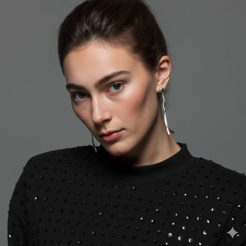 Flicker sterling silver elongated dangle earrings worn by model showing dramatic drop length