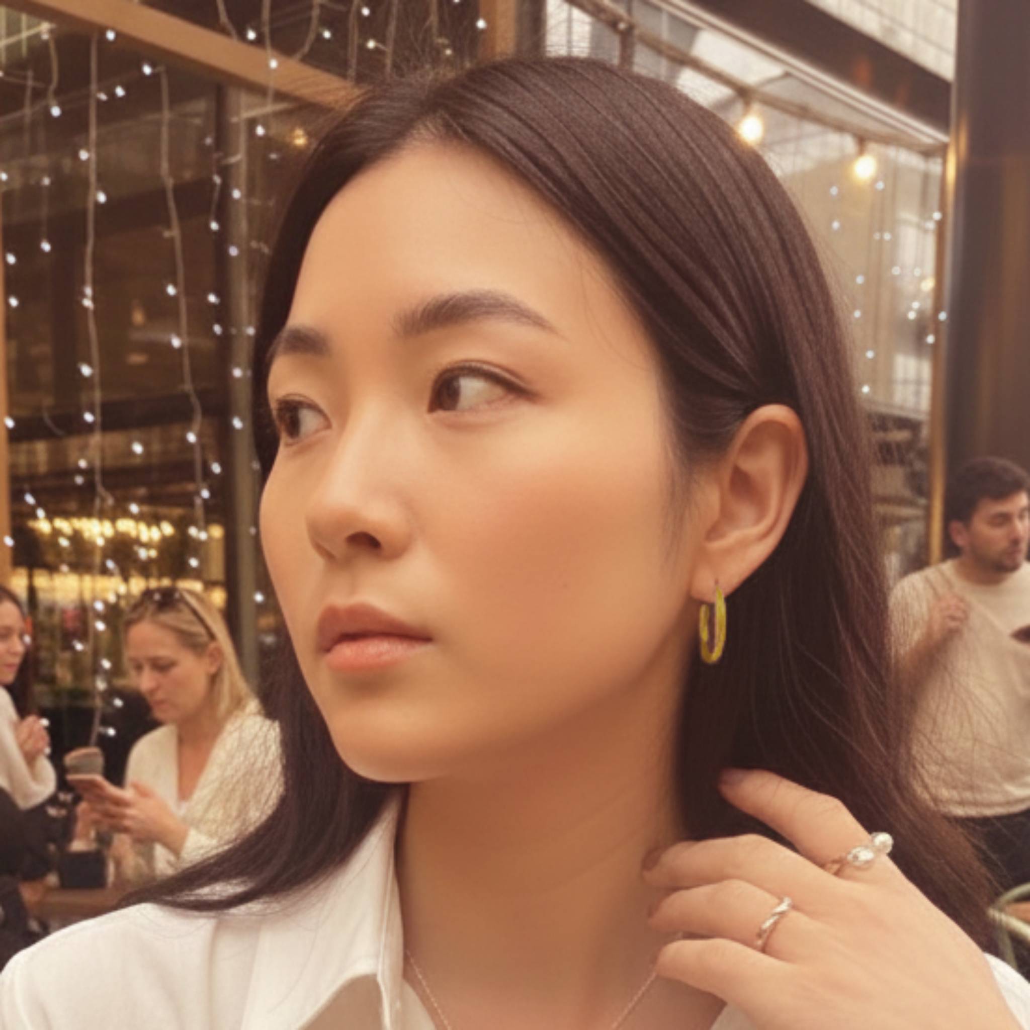 Large Recollections gold vermeil hoop earrings worn by model showing statement scale