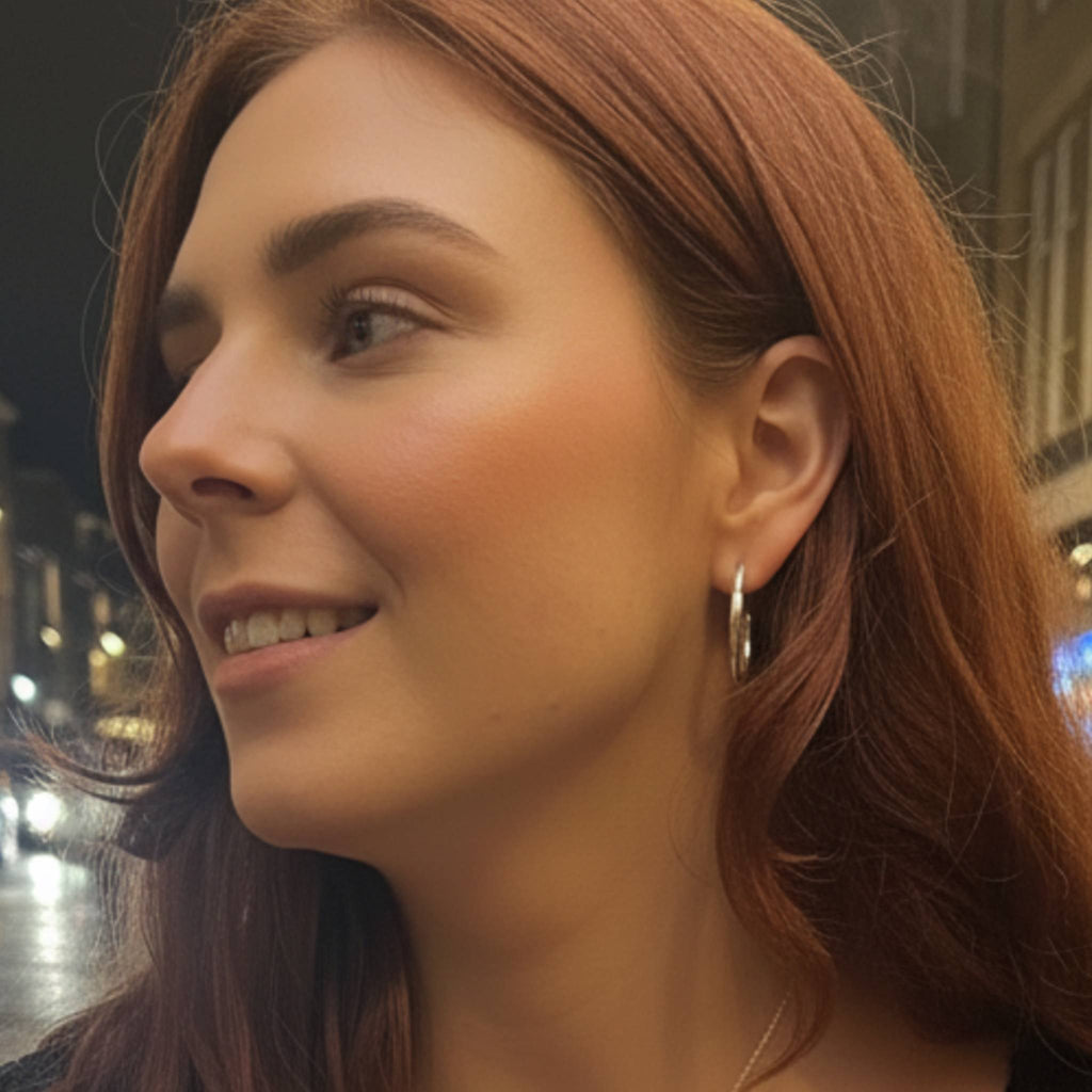 Large Recollections sterling silver hoop earrings worn by model showing statement scale