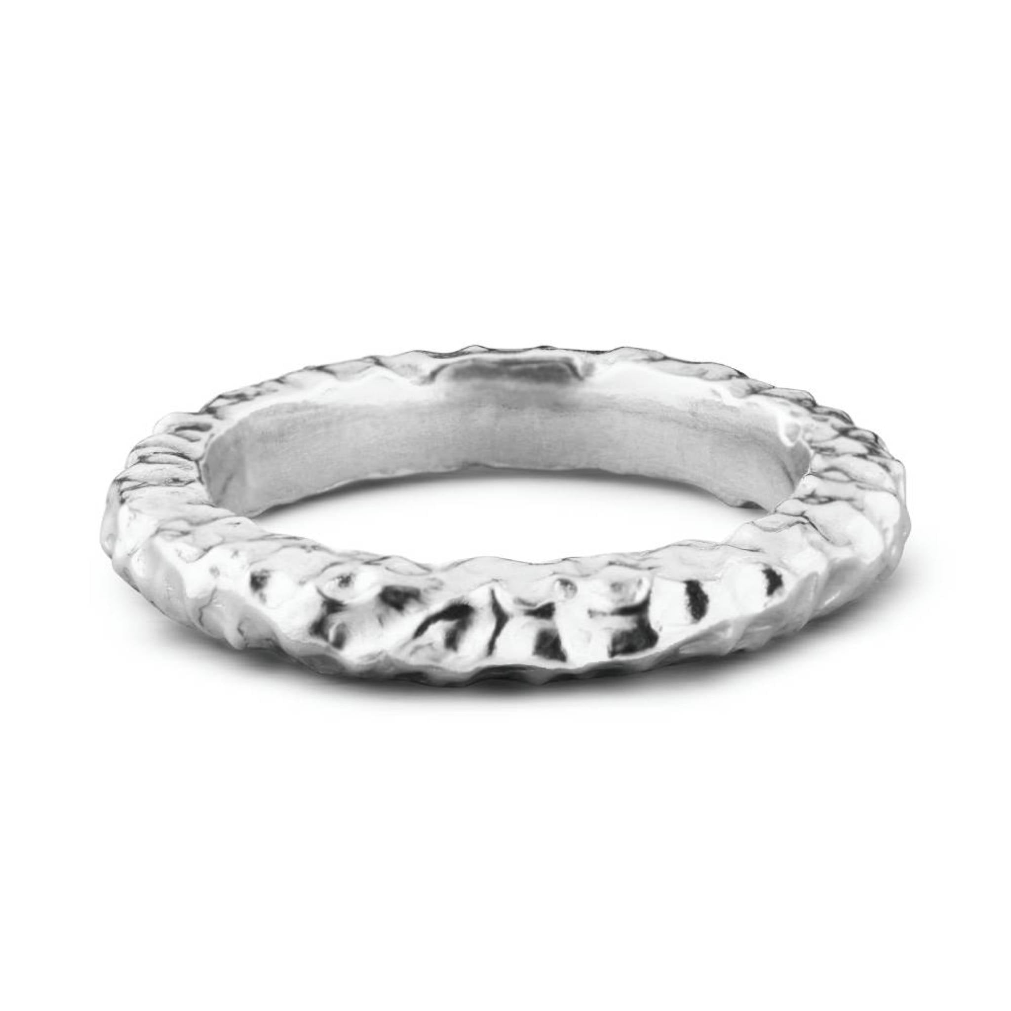 Shy Guy recycled sterling silver textured organic stacking ring close up on white background