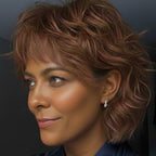 The Huggies sterling silver hoop earrings styled in ear stack on model showing petite fit