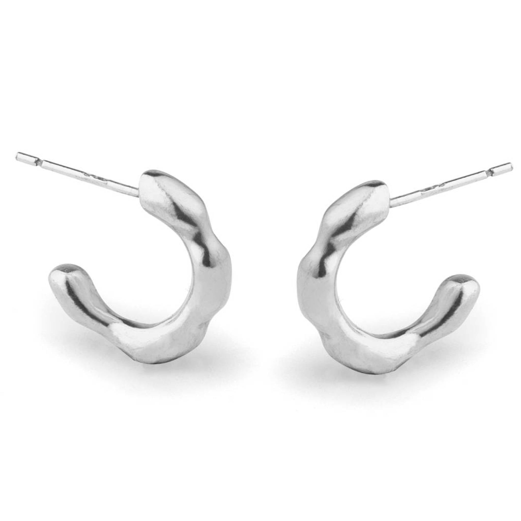 The Huggies recycled sterling silver small hoop earrings front view showing wavy sculptural texture