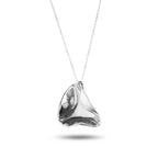 The Hollows recycled sterling silver concave organic pendant necklace close up on white background